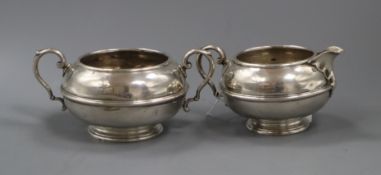 A George V silver cream jug and matching sugar bowl, 13 oz.