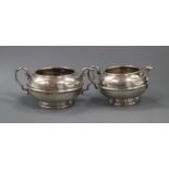 A George V silver cream jug and matching sugar bowl, 13 oz.