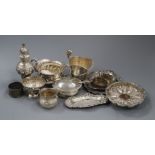 Assorted small silver including two cream jugs, four dishes, sugar bowl, caster, napkin rings etc.