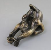 A 19th century bronze oil lamp in the form of an acrobat after Riccio, 5.5in.