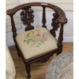 An early 20th century carved walnut corner chair