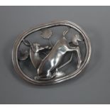 A Danish Georg Jensen sterling 'kneeling deer' oval brooch, no. 256, 43mm.