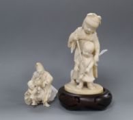 A Meiji carved ivory group of two children (damaged) on hardwood stand and a smaller group tallest