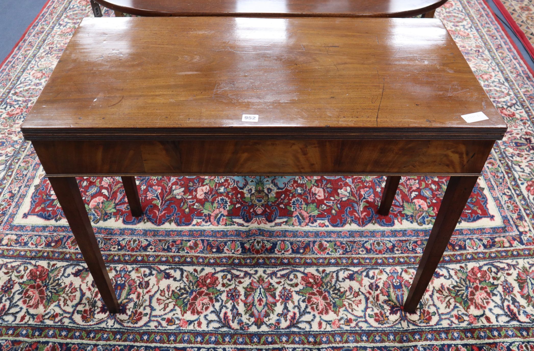 A George III mahogany folding tea table W.96cm