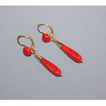 A modern pair of Italian 750 yellow metal and coral drop earrings, overall 41mm.