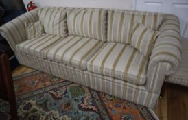A three seater Chesterfield settee upholstered in striped fabric W.226cm