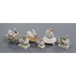 Six Staffordshire porcelain figures of swans, c.1835-50, five modelled seated on a nest, H. 4cm -