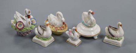 Six Staffordshire porcelain figures of swans, c.1835-50, five modelled seated on a nest, H. 4cm -