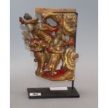 A Chinese gilt and red lacquered carving of figures, on stand length 20cm excl. stand