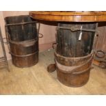 A pair of Chinese staved wood, iron bound salt buckets H.62cm