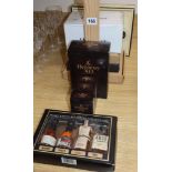 Seven assorted small boxes of small bottles of assorted cognac, bourbon whisky etc. including