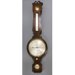 C.Heseltine, Bedford Row. A Regency mahogany wheel barometer with silvered dials 44in.