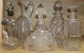 A dimple glass silver-mounted decanter with silver whisky label, a cut glass claret jug and four