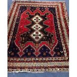 A Shahsavan red ground rug 210 x 164cm