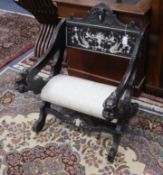 An Italian 19th century carved bone inlaid ebonised elbow chair