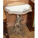 An Italian silvered wood mirrored top occasional table with cherub stem H.80cm