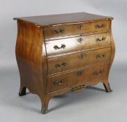 A 19th century Dutch ormolu mounted mahogany bombe commode, with serpentine top, fitted four