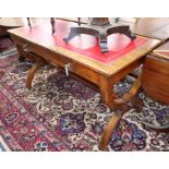A Victorian walnut writing table in the style of Pugin
