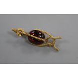 A late Victorian ropetwist yellow metal and cabochon garnet set brooch (a.f. pin broken), 41mm.
