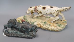 A Continental ceramic figure of a hound, on naturalistic plinth base and a stoneware model of a