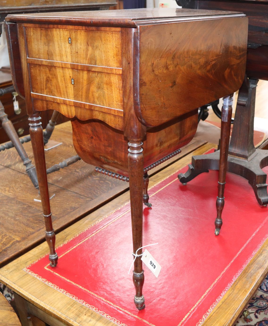 A Regency mahogany work table with drop flap W.52cm