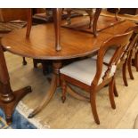 A Regency design twin pillar mahogany dining table 210cm extended (one spare leaf)