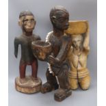 Three African carved and painted wood ethnographical figures tallest 59cm