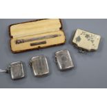 Three assorted silver vesta cases, a cased sterling pencil and a purse.