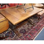 A 1920's oak refectory table L.140cm