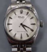 A gentleman's 1950's stainless steel Rolex Oyster manual wind wrist watch, on associated stainless