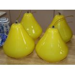 A set of four glass pear shaped light shades height 22cm