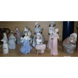 Thirteen Nao figures of children holding animals