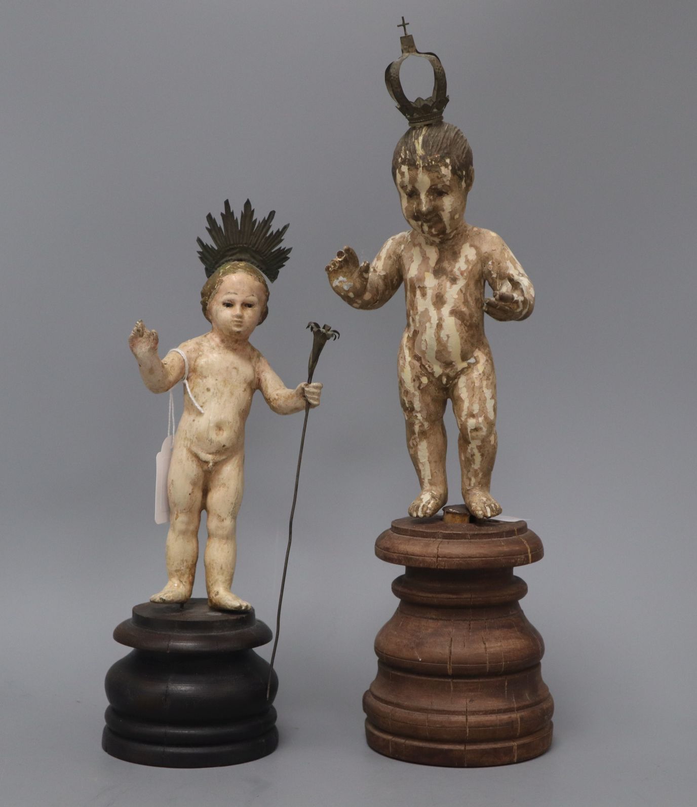 Two South American carved and painted wood figures tallest 41cm