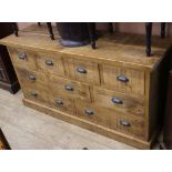 A modern oak chest of nine drawers W.152cm