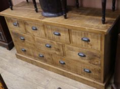 A modern oak chest of nine drawers W.152cm