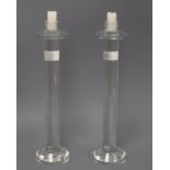 A pair of modern glass candlesticks height 36cm