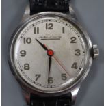 A gentleman's stainless steel Jaeger LeCoultre manual wind wrist watch, on later associated strap.