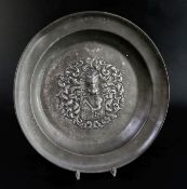 An 18th century Austro-German pewter dish, with embossed armorials, diameter 14in.