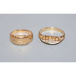 Two early 20th century 18ct gold and diamond set dress rings.