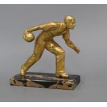An Art Deco gilt metal figure of a bowls player, on marble base height 18cm