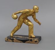 An Art Deco gilt metal figure of a bowls player, on marble base height 18cm