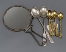 A set of six late Victorian ornate silver gilt teaspoons with vineous handles by Daniel & John