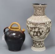 A modern Chinese large baluster vase carved in low relief with scenes on a brown ground and a