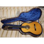 A Takumi luthier acoustic guitar with hard case