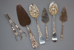 Two George III silver berry spoons, a pair of silver grape shears, a pair of small servers and a