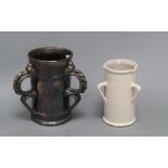 An unusual Dicker ware black lustre three handled tyg and a similar three handled tin glazed pot