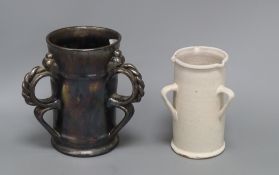 An unusual Dicker ware black lustre three handled tyg and a similar three handled tin glazed pot