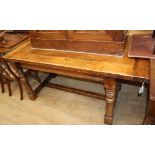 A 17th century style oak refectory dining table L.164cm