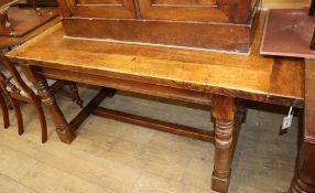 A 17th century style oak refectory dining table L.164cm