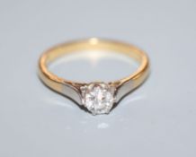 A diamond solitaire ring, '18ct and plat' setting, gross 3 grams, size O.